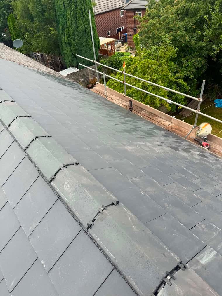 Slate roof and ridge line viewed from the scaffold